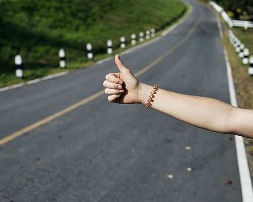 arm-asphalt-blur-close-up