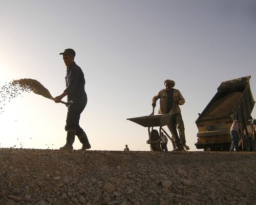 construction_workers_shovel_wheelbarrow_dump_truck_road_site_building-796600